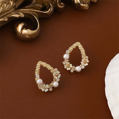 Elegant 18K gold-plated floral teardrop earrings adorned with pearls and cubic zirconia for a stunning look.