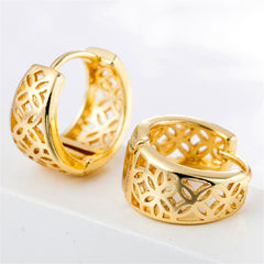 Stunning gold-plated huggie earrings showcasing intricate designs, a chic addition to any jewelry collection.