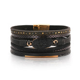 Elegant black leather bracelet featuring stunning 18K gold-plated accents for a chic and stylish look.
