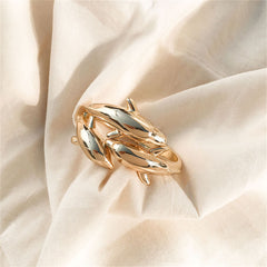A luxurious 18K gold-plated bracelet with a unique tri-dolphin bypass design, symbolizing grace and elegance.
