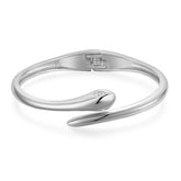 Elegant silver bracelet with a curved design, showcasing a snake bypass style and embellished with cubic zirconia.