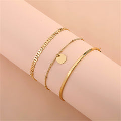 Three beautiful gold bracelets with a disc charm, showcasing 18K gold-plated elegance and sequin charm details.