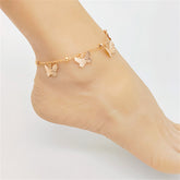 Elegant 18K gold-plated anklet adorned with delicate flowers and charming butterfly accents, perfect for any occasion.