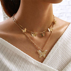 Elegant 18K gold-plated layered necklace featuring delicate butterfly charms, perfect for adding a touch of whimsy to any outfit.