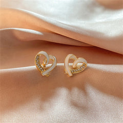 Exquisite gold and white enamel heart stud earrings, featuring 18K gold plating and dazzling cubic zirconia accents.