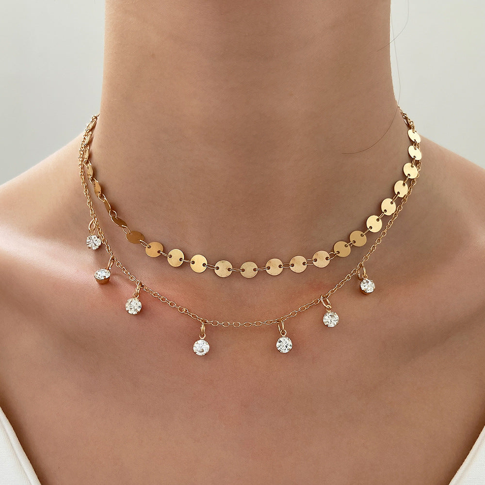 Exquisite 18K gold-plated necklace adorned with sparkling diamonds and crystals, a true statement of luxury and elegance.