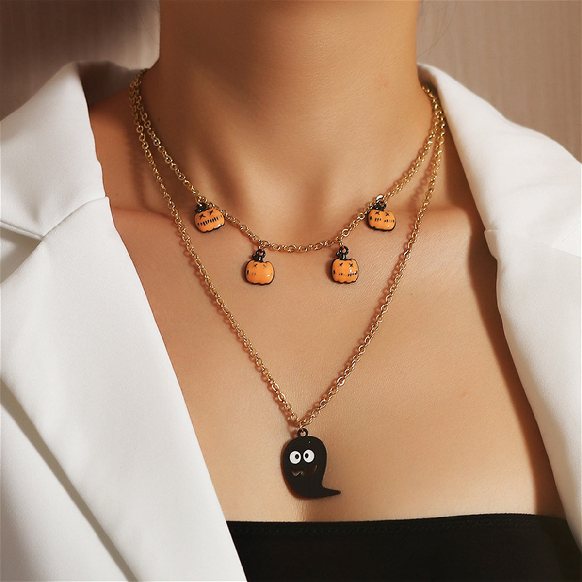 18K gold-plated layered necklace featuring a ghost and pumpkin pendant, perfect for Halloween festivities.