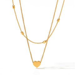 Stunning 18K gold-plated beaded choker with a delicate heart charm, ideal for expressing your unique style and affection.