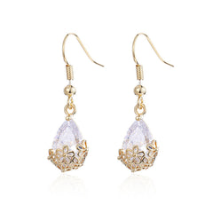 Dazzling 18K gold-plated crystal drop earrings with a floral motif, perfect for special occasions or everyday elegance.
