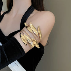 Stunning gold arm cuff adorned with delicate leaves, crafted in 18K gold-plated for a luxurious, nature-inspired look.