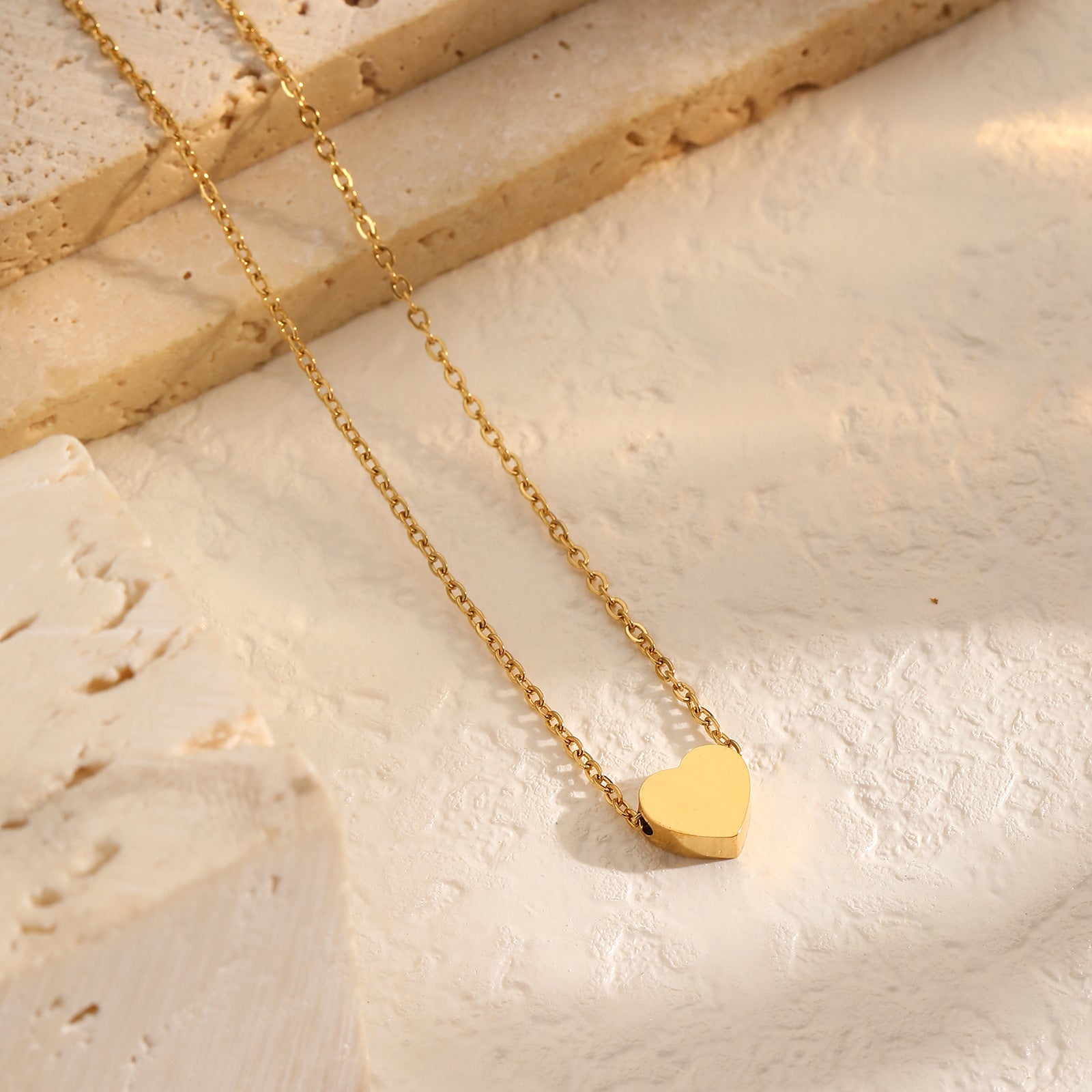 18K gold-plated heart pendant necklace with a delicate small chain, perfect for adding elegance to any outfit.