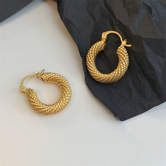 Gorgeous 18K gold plated twisted hoop earrings, beautifully braided for a sophisticated touch to your look.