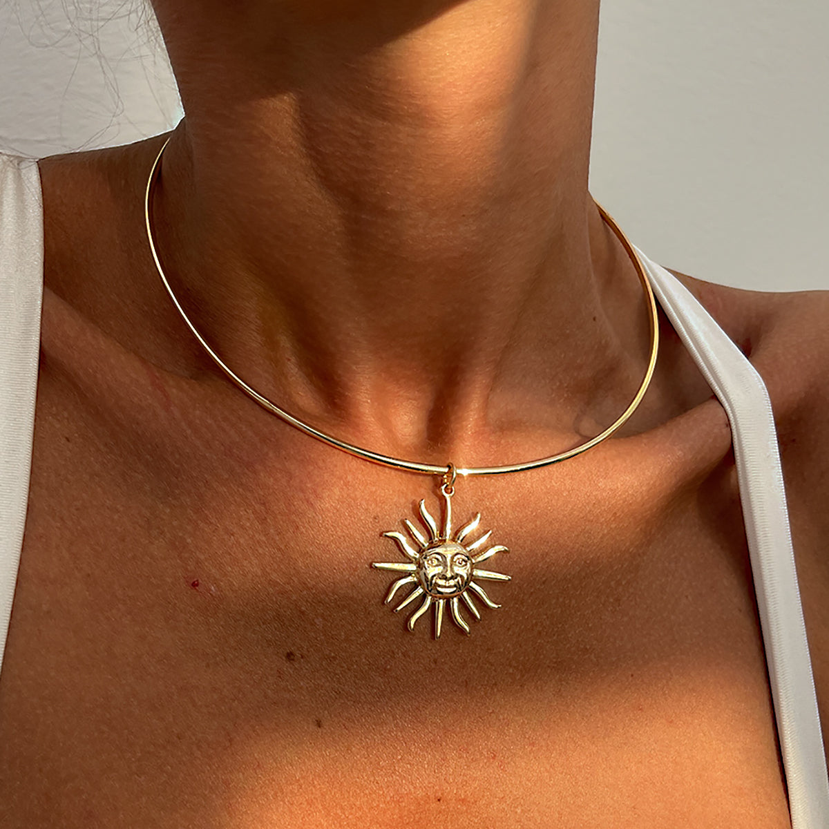 Goldtone Sun Pendant Choker, vintage-inspired design, lifestyle look