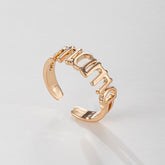 Elegant rose gold ring featuring the word "Mom," crafted in 18K gold-plated design for a heartfelt gift.