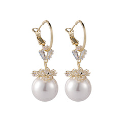 Dazzling 18k gold-plated huggie earrings with white pearls and crystal accents, perfect for any occasion.