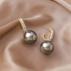 Chic gray pearl drop earrings adorned with diamonds, set in 18K gold plating and enhanced with cubic zirconia.