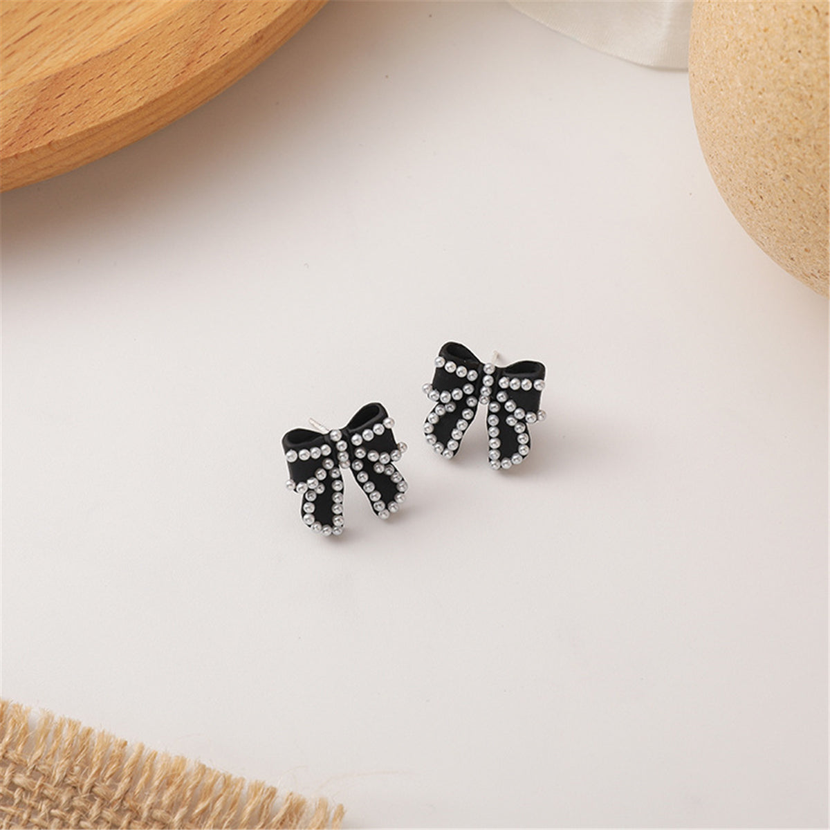 Pearl and Black Enamel Silver-Plated Bow Stud Earrings, silver stud earrings for women, botanical inspired, detail close-up