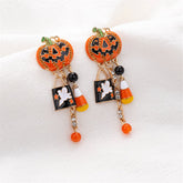 Halloween earrings featuring candy corn and pumpkins with cubic zirconia ghost dangle drops for a festive look.