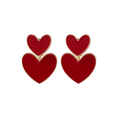 Eye-catching red heart-shaped ear jackets, adorned with 18K gold plating for a fashionable touch.