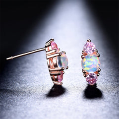 Stunning opalite stud earrings with a layered design of round-cut opal and pink cubic zirconia for added shine.