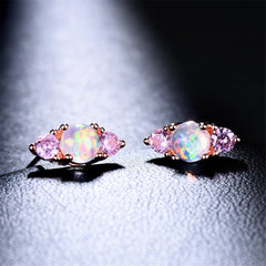 Dazzling opalite stud earrings, showcasing stacked round-cut opal and pink cubic zirconia for a chic look.