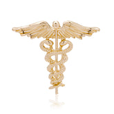 Elegant 18K gold-plated caduceus brooch featuring angel wings and a snake, symbolizing healing and protection in medicine.