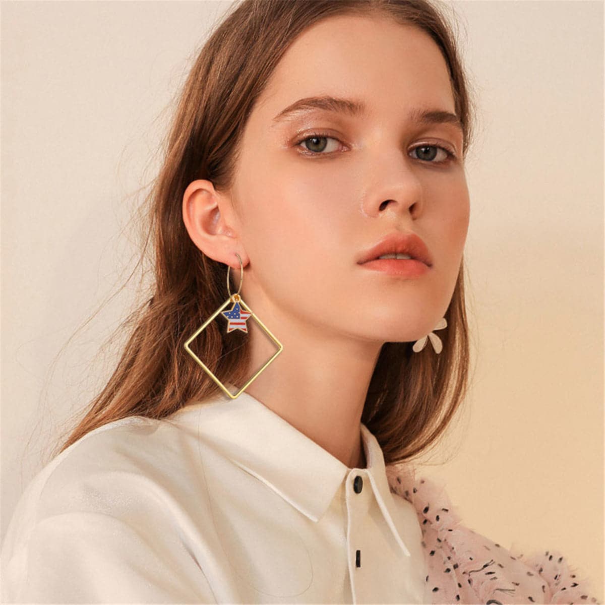 Stunning 18K gold-plated earrings shaped like the American flag, featuring a star, ideal for patriotic occasions.