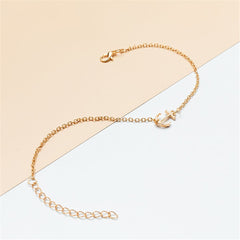 Beautiful gold chain anklet adorned with a small anchor charm, designed in 18K gold plating for a stylish look.