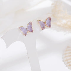 Charming butterfly earrings with rose gold details, embellished with purple crystals for a stylish touch.