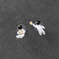 Adorable white astronaut stud earrings for kids, designed with an oil drip look and 18K gold plating.