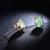 Green opal stud earrings set in elegant 18k rose gold, showcasing a classic and sophisticated design.