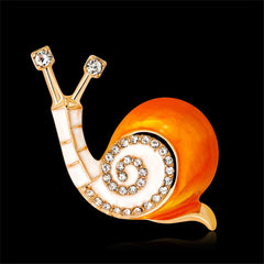 Dazzling snail brooch in gold and white, set with cubic zirconia crystals, a chic accessory for any stylish outfit.