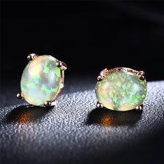 Elegant green opal stud earrings crafted in 18k rose gold, perfect for adding a touch of luxury to any outfit.