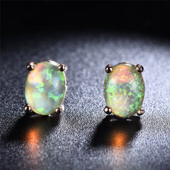 Stunning green opal stud earrings in 18k rose gold, offering a timeless and chic accessory for any occasion.