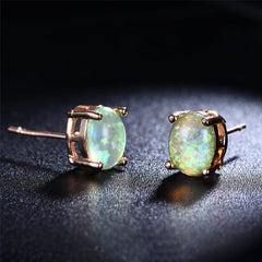 Beautiful green opal stud earrings featuring 18k rose gold settings, ideal for a refined and stylish look.
