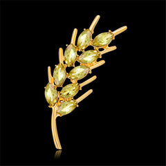 Stunning 18K gold-plated brooch embellished with green stones, featuring a graceful wheat design that adds sophistication.