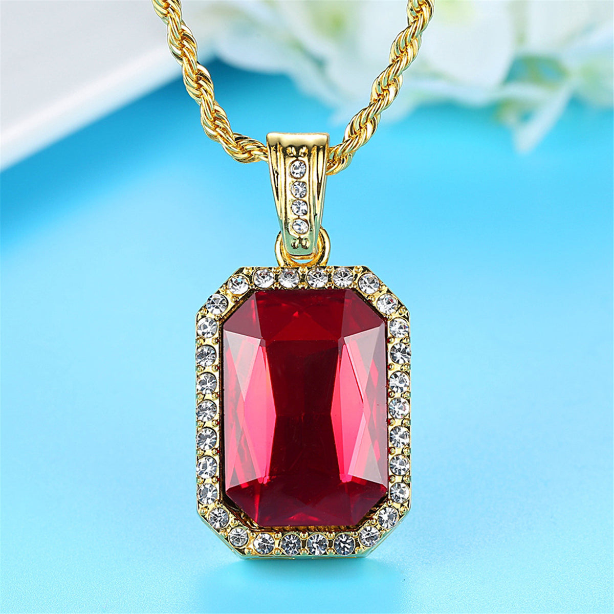 Elegant 18K gold-plated necklace featuring a red crystal pendant adorned with sparkling diamonds. A stunning accessory!