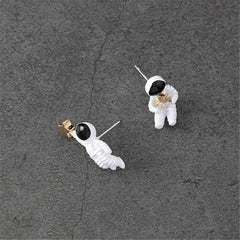 Fun white astronaut earrings for kids, showcasing an oil drip style and 18K gold plating.
