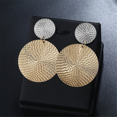 Eye-catching circular disc earrings made from 18K gold and silver wire, perfect for adding elegance to any outfit.