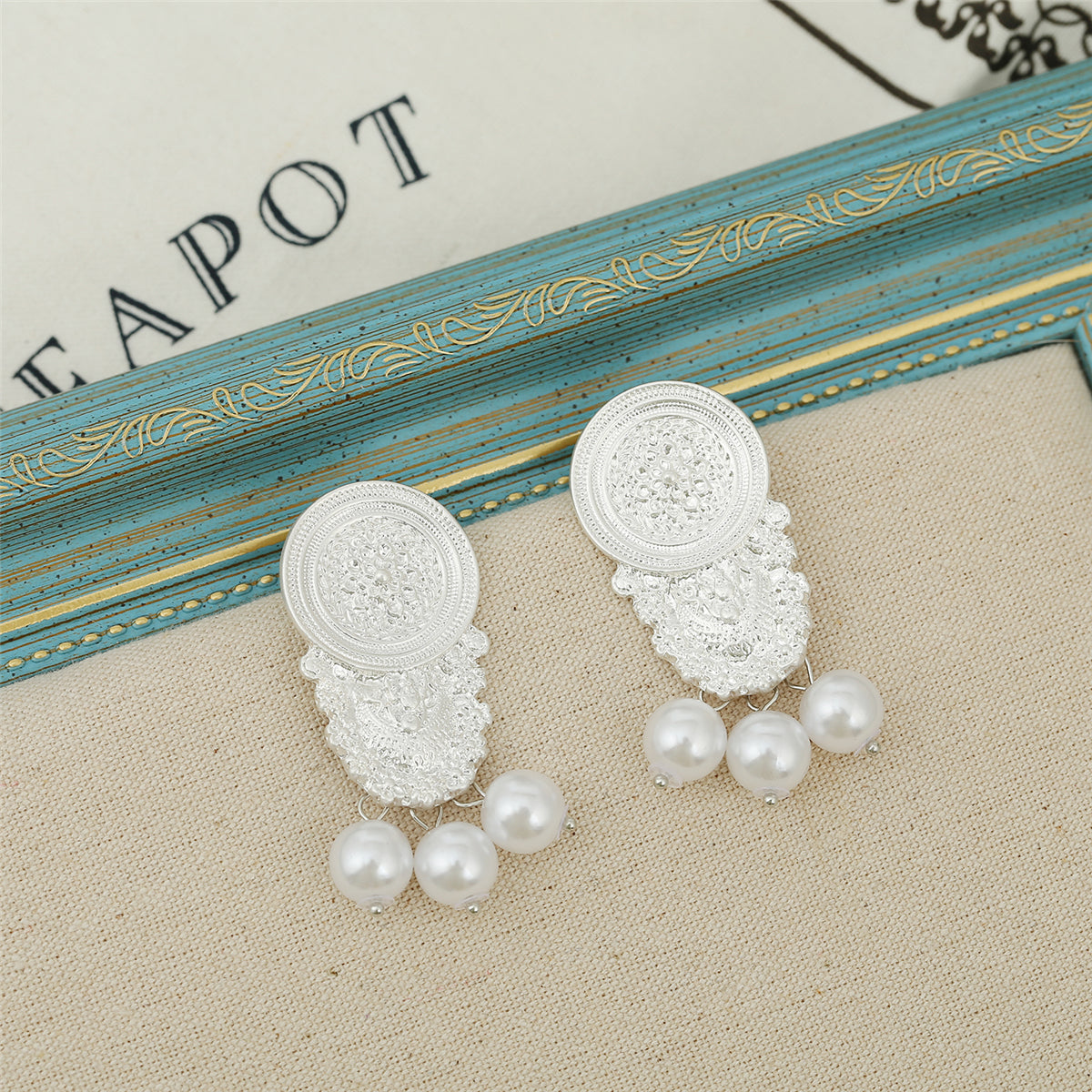 Pearl and Silver-Plated Carved Ornate Drop Earrings, silver drop earrings for women, vintage-inspired design, side view