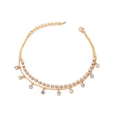 Stunning gold chain anklet crafted with 18K gold plating and white cubic zirconia for added shine.