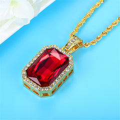 Dazzling red stone pendant with diamonds, elegantly set on a luxurious gold chain. Perfect for any special occasion!