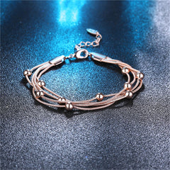 18K rose gold-plated bracelet showcasing four strands of vibrant beads, a stunning addition to your jewelry collection.