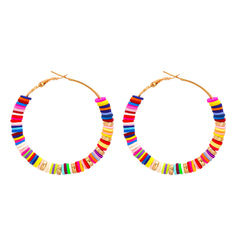 Bright and playful hoop earrings made from wood and metal, featuring multicolor polymer clay and 18K gold-plated accents.
