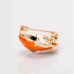 Luxurious gold and white snail brooch with sparkling crystals, a must-have piece for those who appreciate fine jewelry.