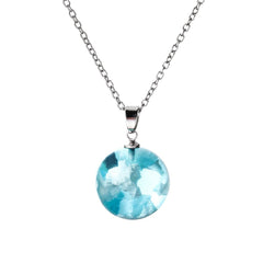 A stunning blue topaz pendant hangs from a silver chain, designed as a cloud for a unique touch.