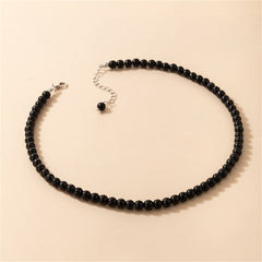 Black quartz beaded choker with a polished silver clasp for a chic look.