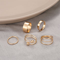 Elegant trio of 18K gold-plated rings with unique designs, perfect for layering or making a statement on their own.