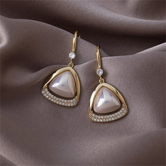 Chic gold-plated earrings showcasing an open-triangle design, accented with white stones and a pearl for elegance.