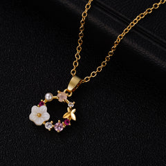 Elegant 18k gold-plated necklace with pink flower and crystal accents, perfect for adding a touch of glamour.